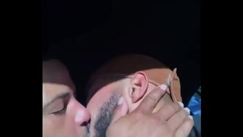 Gay men kiss on public